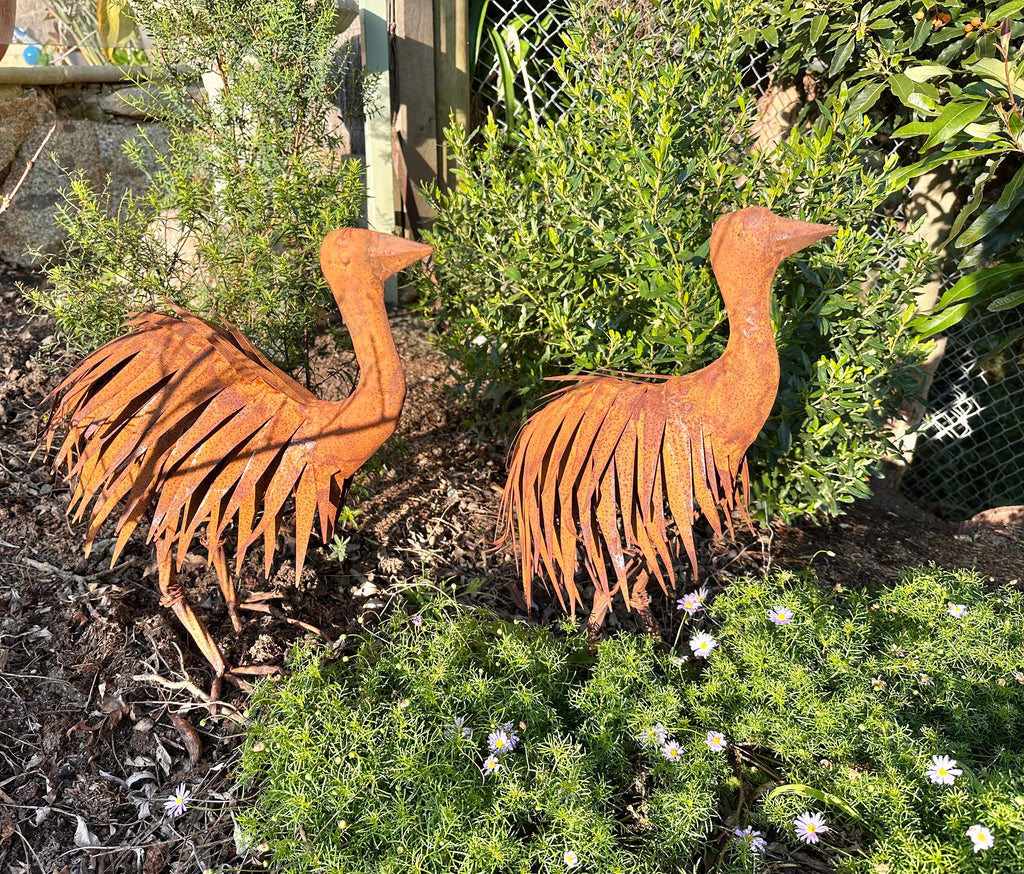 Rusty metal emu chick garden statue