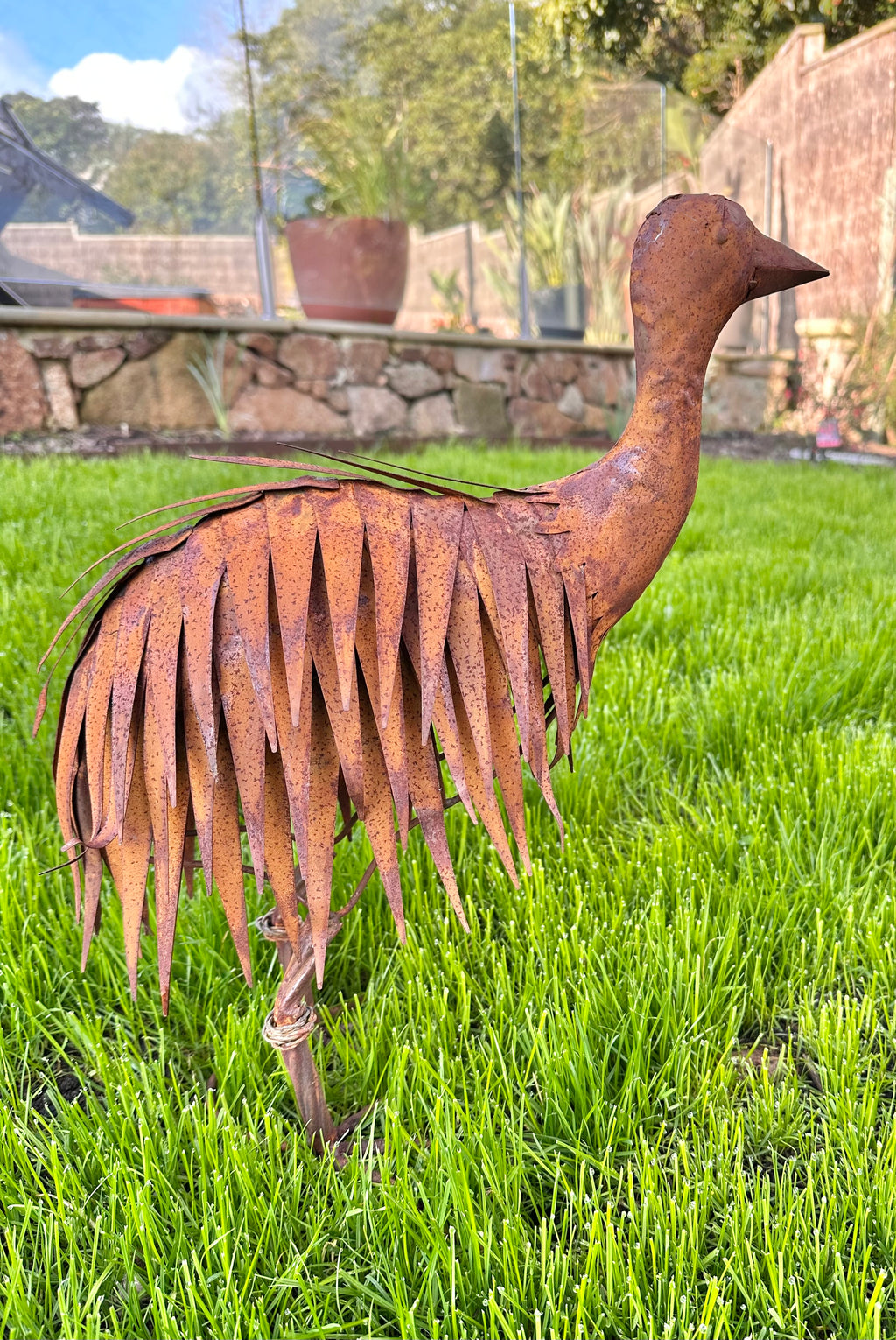 Rusty metal emu chick garden statue